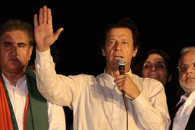 DEFIANT. Imran Khan (C) talks to his supporters during a press conference in Lahore on August 13. File photo by Rahat Dar/EPA