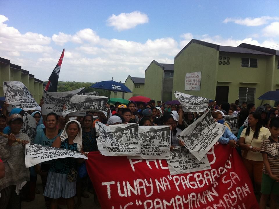 OCCUPY BULACAN. Urban poor residents occupy idle units in a resettlement site in Bulacan. Photo by Kadamay   