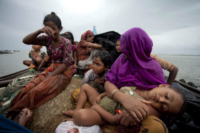 INCREASINGLY DESPERATE. Rohingya Muslim women and children fleeing sectarian violence in Myanmar sit in a boat after they were intercepted by the Bangladesh Border Guard (BGB) members in Teknaf, Bangladesh, back in June 2012. File EPA photo 