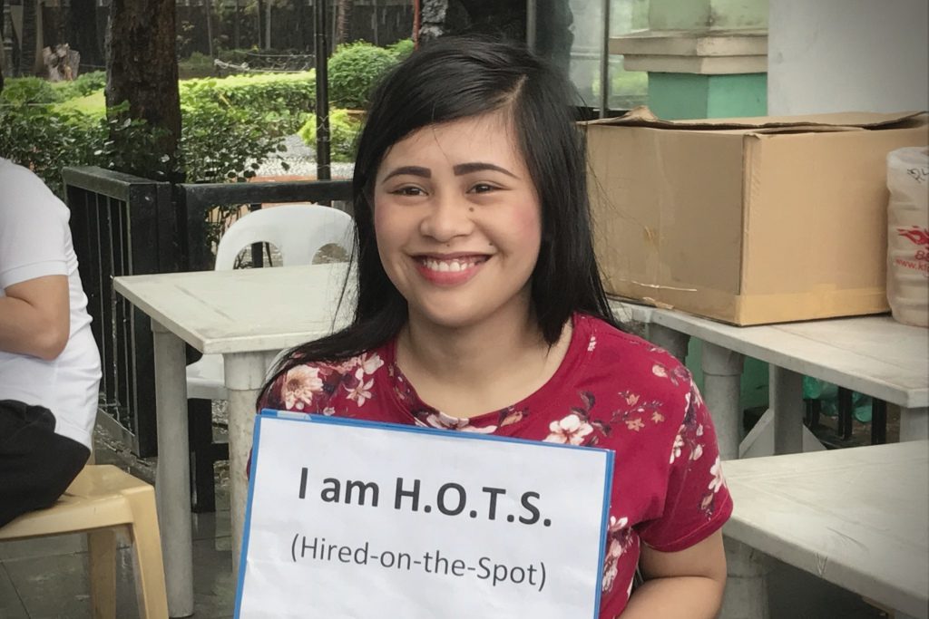 HIRED. Christina Malbas, 20, is hired on the spot during the Independence Day job fair at Rizal Park in Manila on June 12, 2018. Photo by Aika Rey/Rappler  