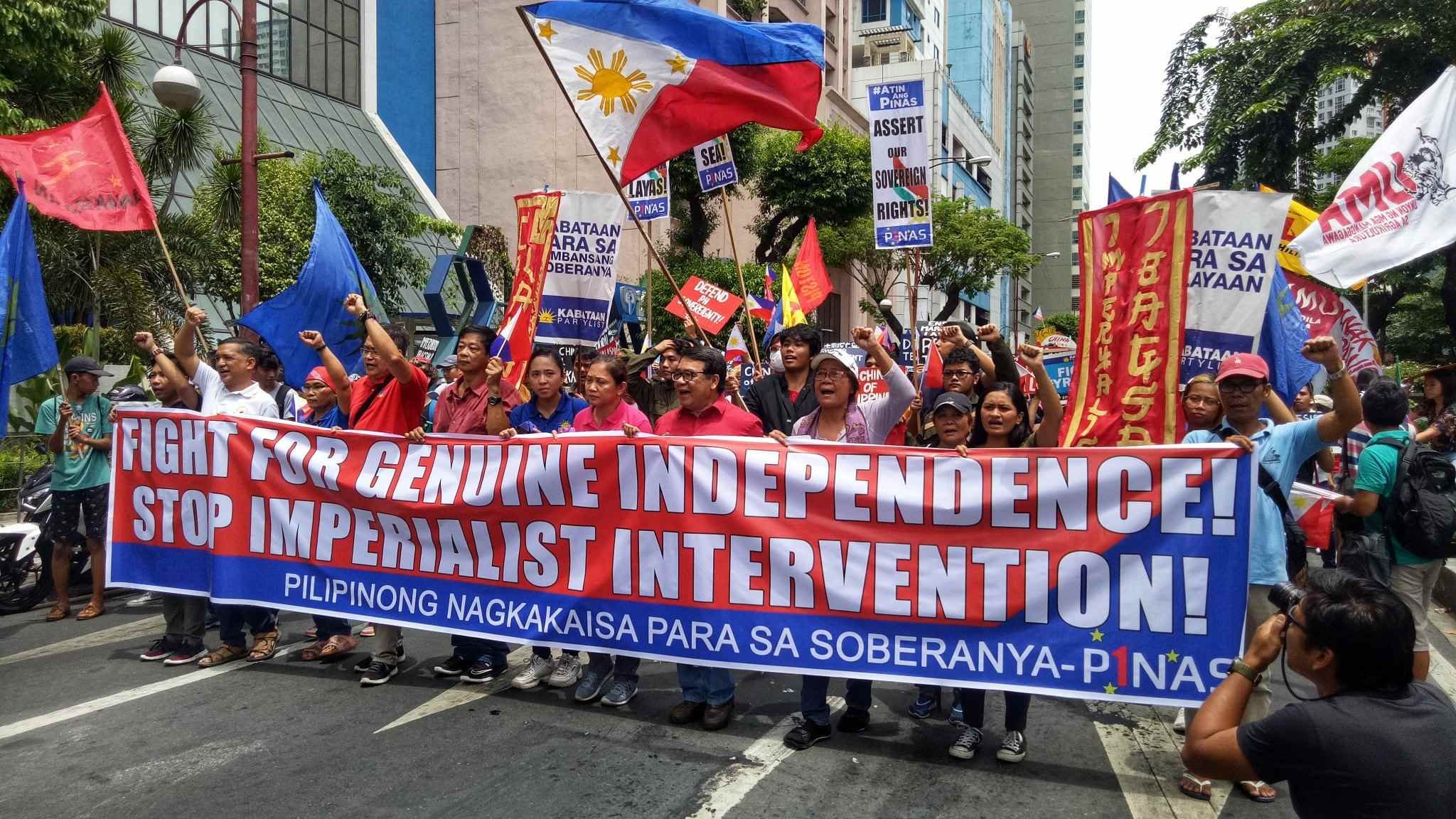 MAKATI. Various youth and student groups rally at the Chinese Consulate in Makati City on Independence Day to uphold national sovereignty as China continues to occupy the disputed islands in the West Philippine Sea. Photo by John Philip Bravo/Rappler  