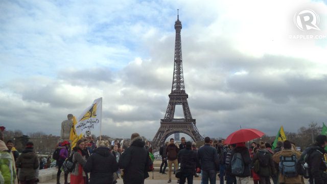 EIFFEL TOWER. Advocates gather in front of the Eiffel Tower to call for climate justice 
