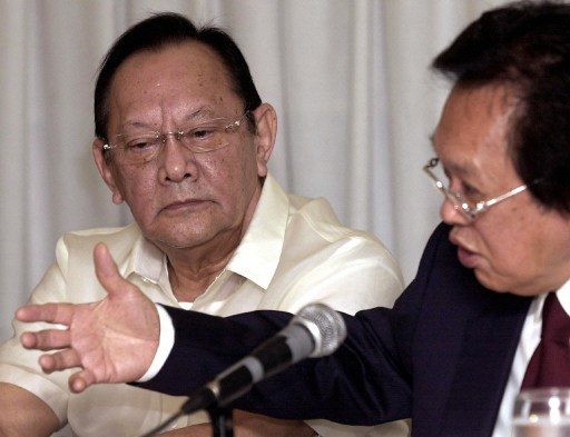 SC TIES. San Miguel Chairman Eduardo Cojuangco Jr here seen with his counsel Estelito Mendoza, who is known for having ties with several SC justices. AFP file photo   