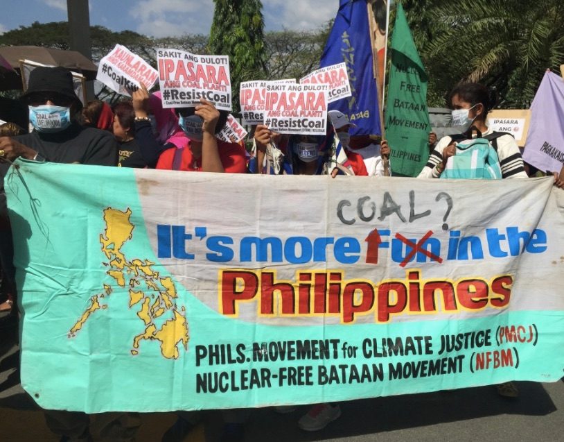 CLOSE THE COAL PLANT. Anti-coal protesters urge DENR to stop the operation of the coal-fired power plant in Bataan that is affiliated with San Miguel Corporation. Photo by Voltaire Tupaz/Rappler 