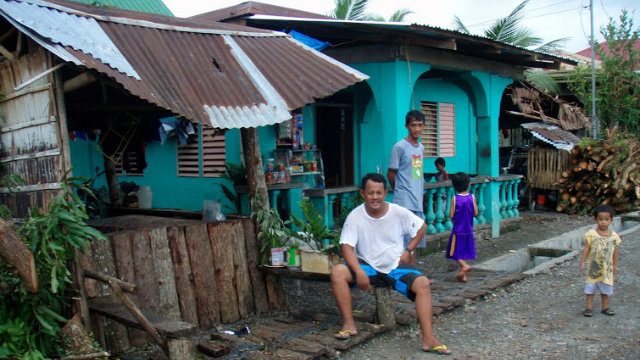 SAFE. Residents of Victoria, Oriental Mindoro, hang out outside their homes after the typhoon. Image courtesy of Myles Delfin.  
