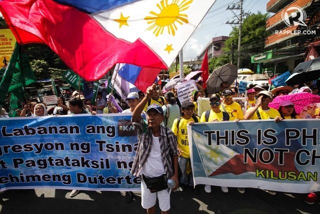 WEST PHILIPPINE SEA. Protesters march near Malacanang ahead of the anniversary of the Hague ruling on the South China Sea on July 9, 2019. Photo by Lito Borras/Rappler  