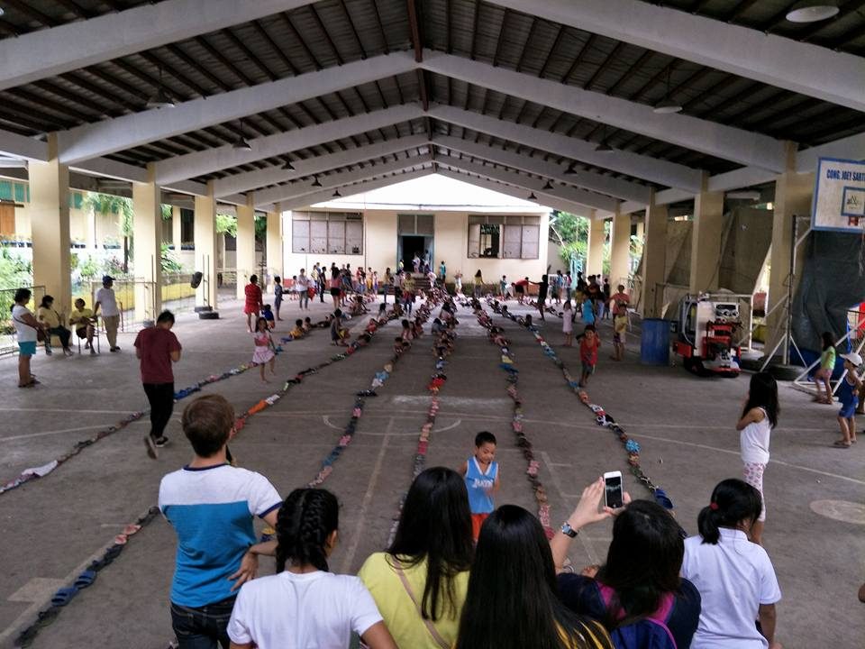 KIDS HOUR. Fun games, gift giving, and feeding for the children evacuees in Albay Central School, Brgy. Matang. Photo from Social Action Center Legazpi Facebook page   