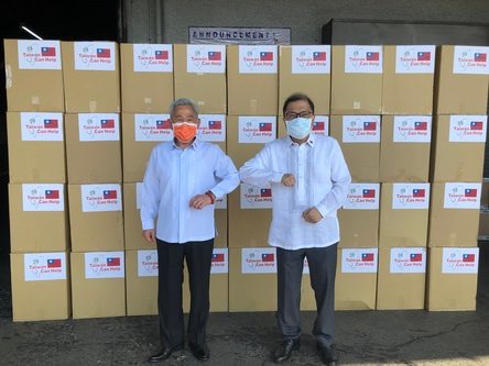 HANDOVER. TECO representative Ambassador Peiyung Hsu and MECO Vice Chairman Gilberto Lauengco pose in front of the medical masks donated by Taiwan. Photo from TECO 