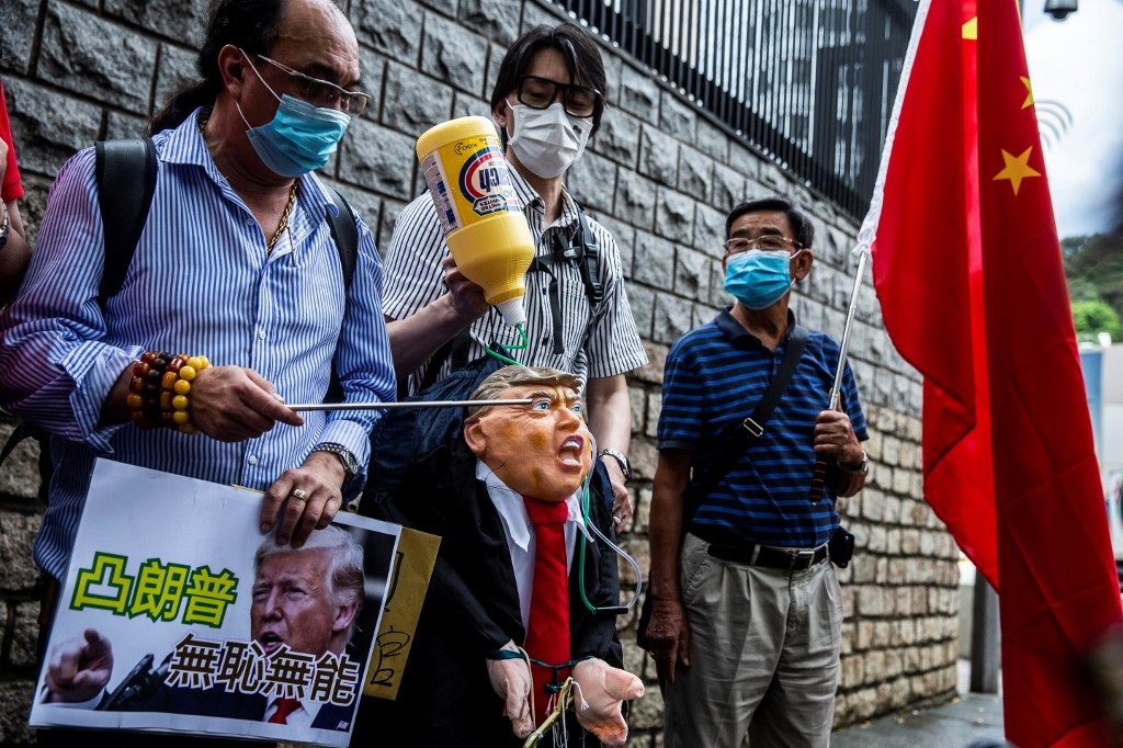 Chinese media use race clashes to criticize U.S. over Hong Kong