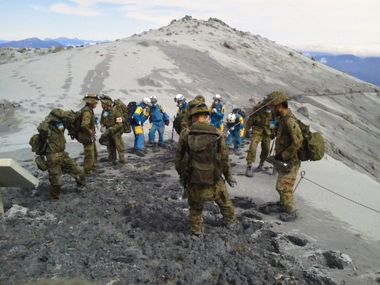 Search for bodies on Japan volcano halted as typhoon looms