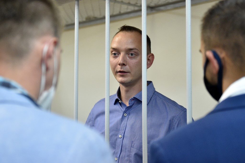 ARRESTED. Ivan Safronov, a former journalist and aide to the head of Russia's space agency Roscosmos, detained on charges of treason for divulging state military secrets, stands inside a defendants' cage during a court hearing in Moscow on July 7, 2020. Photo by Vasily Maximov/AFP 
