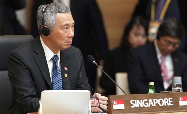 Singapore PM grilled by activist in defamation case