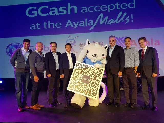 PARTNERS. Alibaba Founder and Executive Chairman Jack Ma (center, left) joins GCat, the GCash Mascot as it shows a sample of the QR code that is set to change the landscape of payments in the country. Together with him are (from L-R): Mynt President and CEO Anthony Thomas, Globe President and CEO Ernest Cu, Ant Financial Services Group CEO Eric Jing, Ayala Corporation President and COO Fernando Zobel de Ayala, Ayala Land President and CEO Bobby Dy, and Ant Financial SVP and Head of International Operations Douglas Feagin. Photo from Globe Corp Comm 