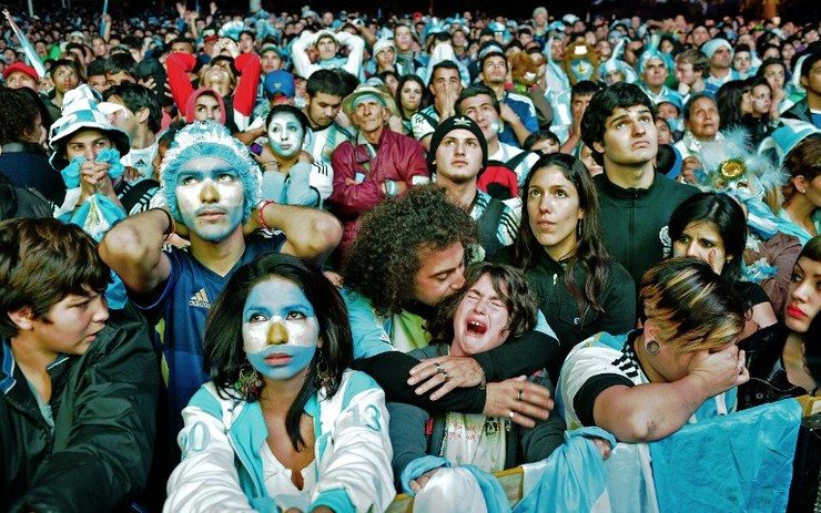 Fans react in dejection as they watch Argentina lose in the World Cup final against Germany on a giant screen at San Martin square in Buenos Aires. Photo by Carl de Souza/AFP