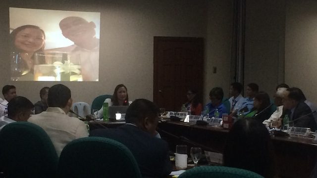 FRIENDS: Whistleblower Rhodora Alvarez presents before the Senate Blue Ribbon Committee her photo with former RASI representative Thack Nguyen 