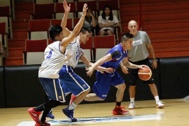 Roger Pogoy (R) dribbles as Rosario (C) and Kiefer Ravena (L) defend. Photo by Czeasar Dancel 