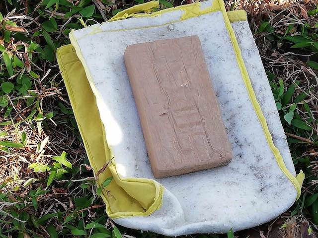 INTACT ON SHORE. The cocaine brick in Quezon is found by barangay watchman. PNP photo  
