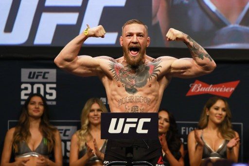 McGregor says he’s signed contract to fight Mayweather