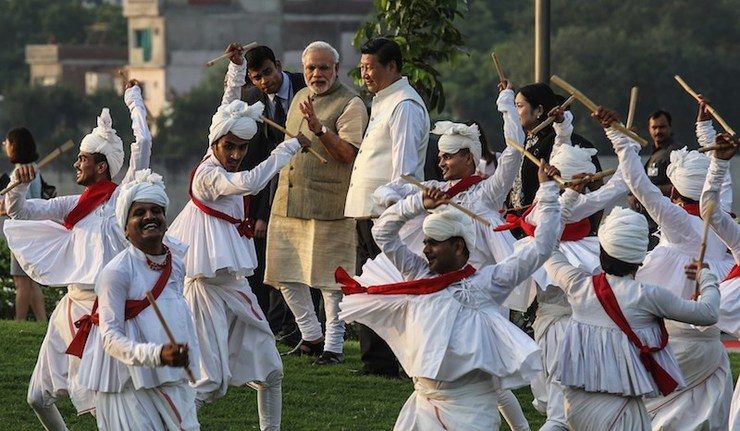 FESTIVITIES. Indian Prime Minister Narendra Modi (center left) escorts Chinese President Xi Jinping through a group of dancers on arrival at the Sabarmati Riverfront project in Ahmedabad, India, 17 September 2014. Divyakant Solanki/EPA
