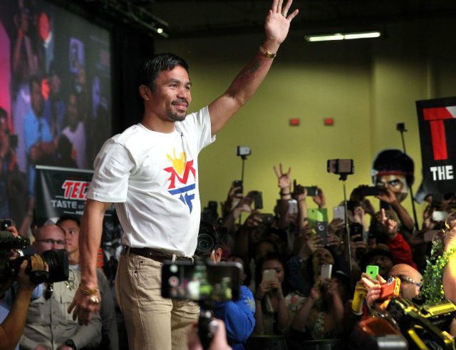 Pacquiao waves to his fans. Photo by Chris Farina - Top Rank 
