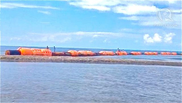 Fishermen remove Chinese-marked buoys off Zambales