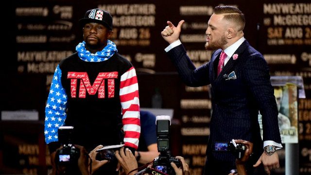Wearing ‘f— you’ suit, McGregor mocks Mayweather over tax issues