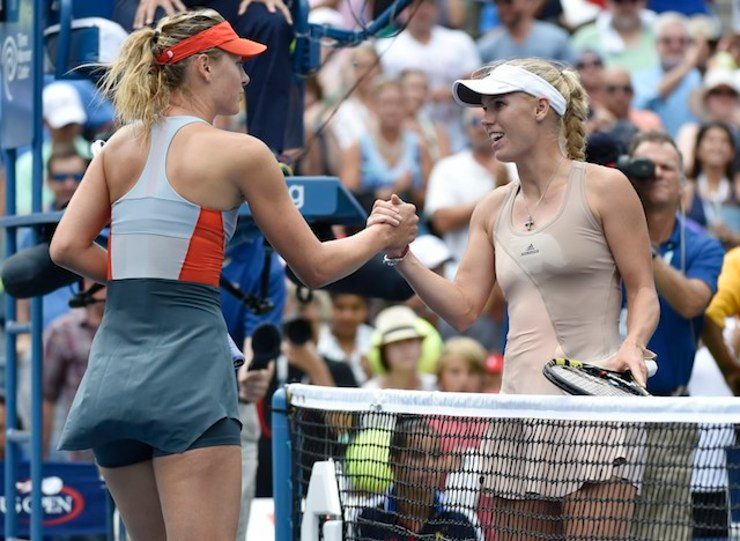 Wozniacki sends Sharapova out of US Open, Federer battles
