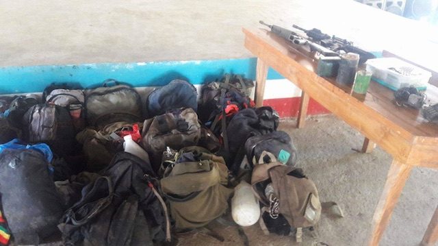 RECOVERED ITEMS. Firearms and personal possessions were among those recovered at the encounter site. Photo from the military  
