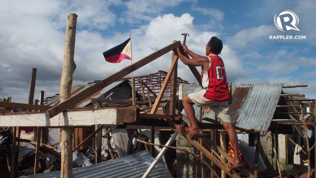 REBUILDING. A Yolanda survivor begins fixing his home, just weeks after the typhoon hit Eastern Visayas. File photo by Jake Versoza