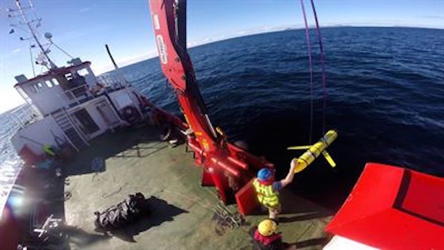 YELLOW DRONES. This photo shows the recovery of US ocean gliders off the coast of Scotland. A similar unmanned underwater vehicle was seized by the Chinese Navy off the coast of the Philippines. Photo from the Pentagon web site  