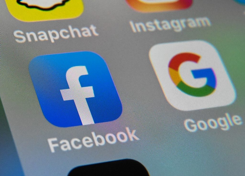 Australia stops short of major clampdown on Facebook, Google