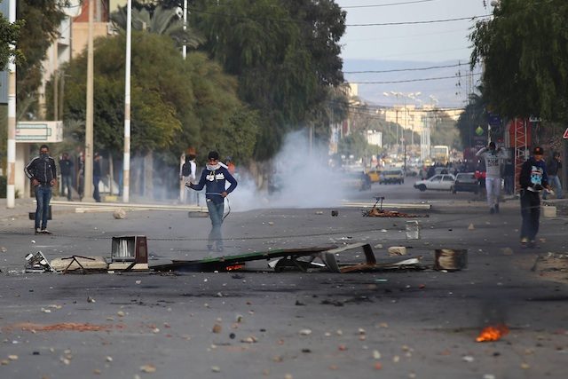 Tunisia imposes curfew after worst post-revolt unrest