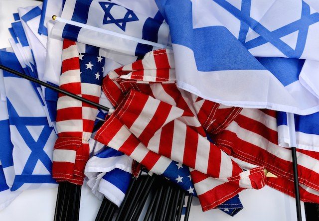 American and Israeli flags are gathered during a rally held by the New York area Jewish community to show support for Israel in the conflict with Hamas, in New York, New York, USA, 28 July 2014. Justin Lane/EPA