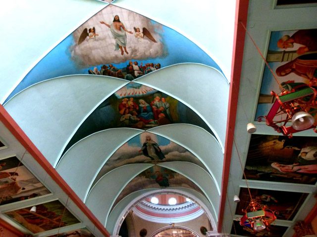 LOOK UP. Check out the ceiling paintings depicting biblical scenes inside Binondo Church. Photo by Julius Estur