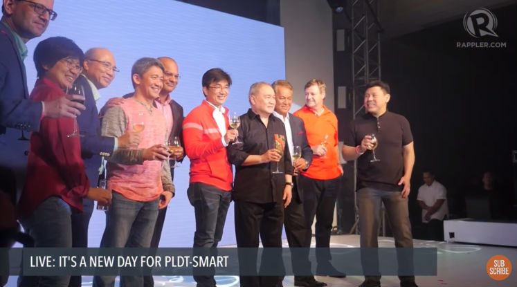 WELCOME CHANGE. PLDT and Smart executives join Manny Pangilinan (center) onstage for a toast to new beginnings. Screengrab from Rappler YouTube 