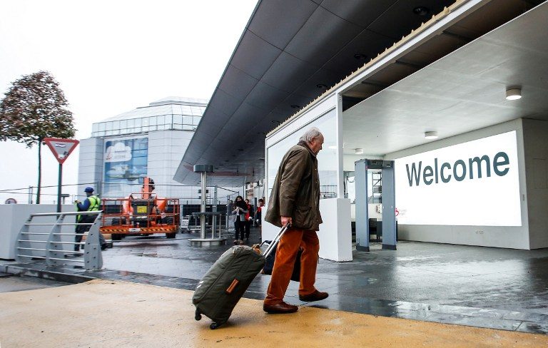 ZAVENTEM AIRPORT. A man enters Brussels Airport in Zaventem by a new double-door entrance set up following new security measures, on November 7, 2016. Photo by Theirry Roge/ Belga / AFP 