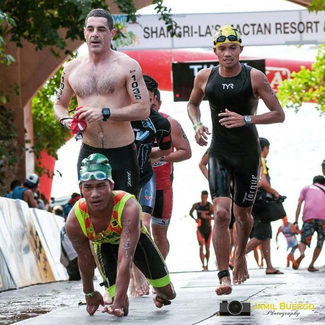 NO EXCUSES. Double-leg amputee Jomar leads most of swimmers out of the 1.9k-swim at the Cobra 70.3 Ironman at Cebu City. Photo courtesy of the ParaTriathlon Association of the Philippines/ Jamil Buergo. 