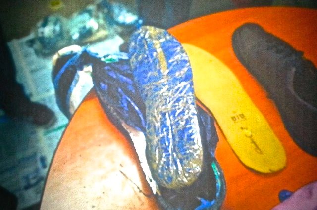 STASH. The heroin is placed in dark plastic material formed like the sole of a shoe. Photo from MIAA   