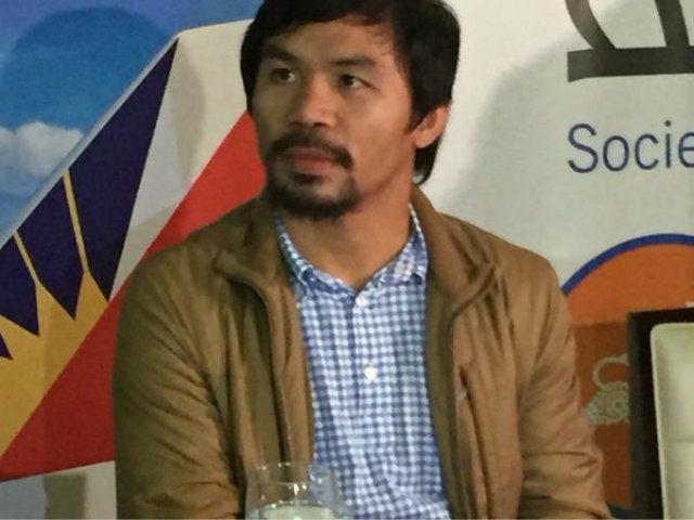 Pacquiao denies reports of Mayweather talks, heads to New York