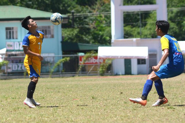 LEARNING FROM FOOTBALL. Chester Gio Pabualan (L) shares how he's learned discipline by playing football. Photo by Roy Secretario/Rappler   