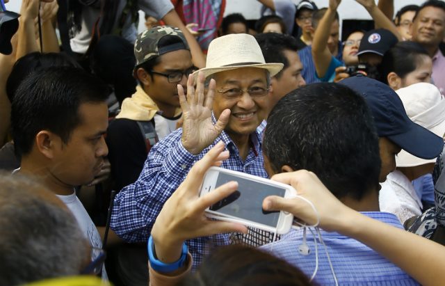 Pressure rises on Malaysian PM as ex-leader backs protests