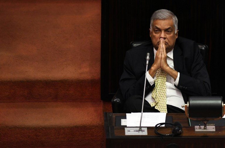 Sri Lanka reinstates ousted prime minister, ending power struggle