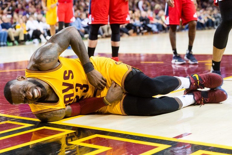 WATCH: LeBron James goes down in pain after knee to the groin