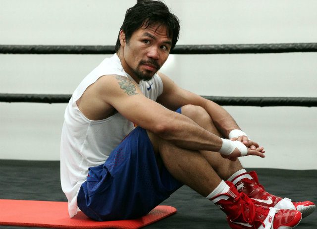 Manny Pacquiao catches his breath. Photo by Chris Farina - Top Rank 