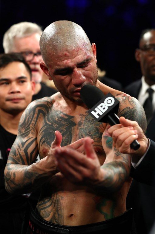 NO EXCUSES. Miguel Cotto points to his torn bicep after losing his Junior Middleweight bout against Sadam Ali at Madison Square Garden on December 02, 2017 in New York City. Photo by Al Bello/Getty Images/AFP
  