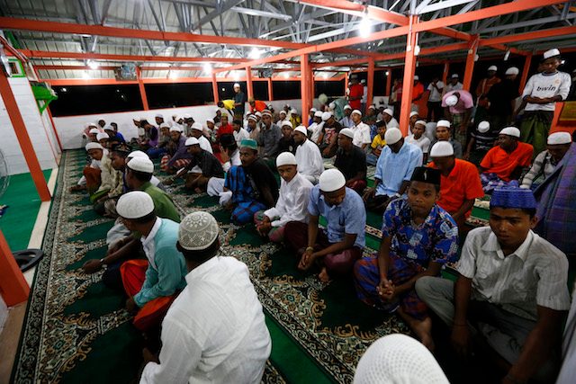 MORNING PRAYERS. Rohingya Muslims migrants attend morning prayers in a mosque at a refugee camp in Bireun Bayeun, East Aceh on June 18, 2015. Photo by EPA 