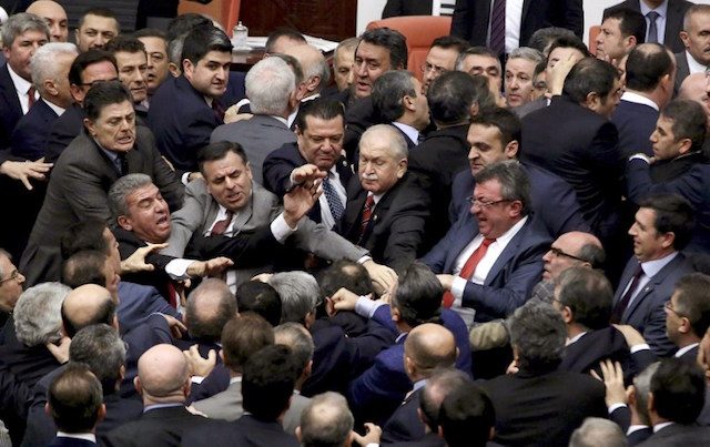 BRAWL AT PARLIAMENT. Ruling Justice and Development Party and main opposition Republican People's Party lawmakers scuffle at the parliament in Ankara during deliberations over a controversial 18-article bill to change the constitution to create an executive presidency January 11, 2017. AFP photo 