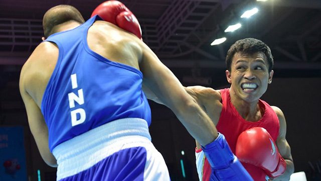 Charly Suarez (R) is making his Olympic debut 20 years after he first started boxing. File photo from AFP  