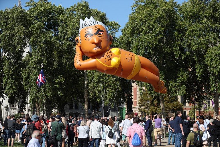 Balloon of mayor Khan in bikini flies over London