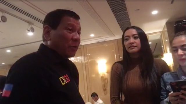 NEW OFFICIAL. President Rodrigo Duterte speaks with newly appointed Communications Assistant Secretary Mocha Uson in Hong Kong. Screenshot from Uson's Facebook page 